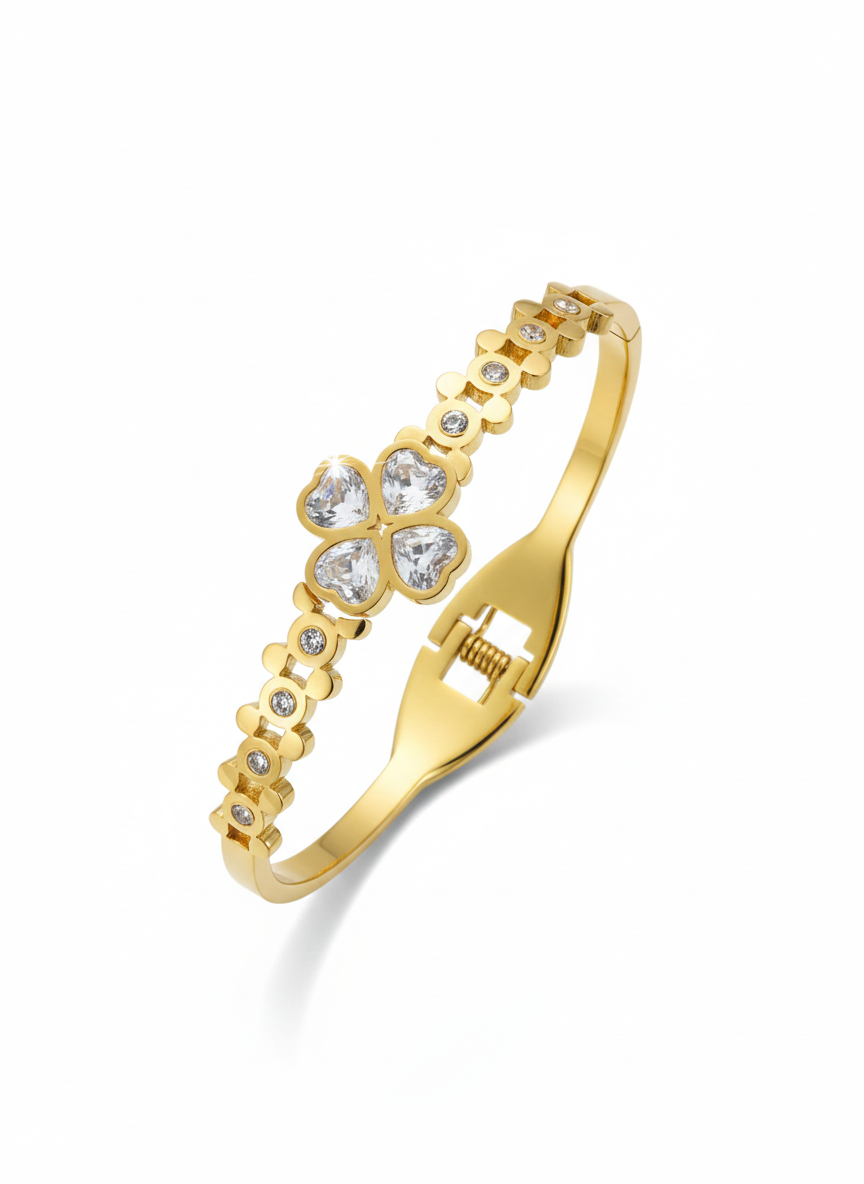 Gold bracelet with floral designs and clear stones 