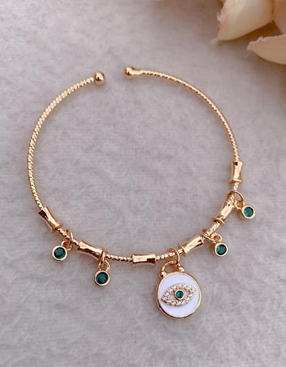 Handcrafted Artisanal Evil Eye Bracelet with Emerald Accents