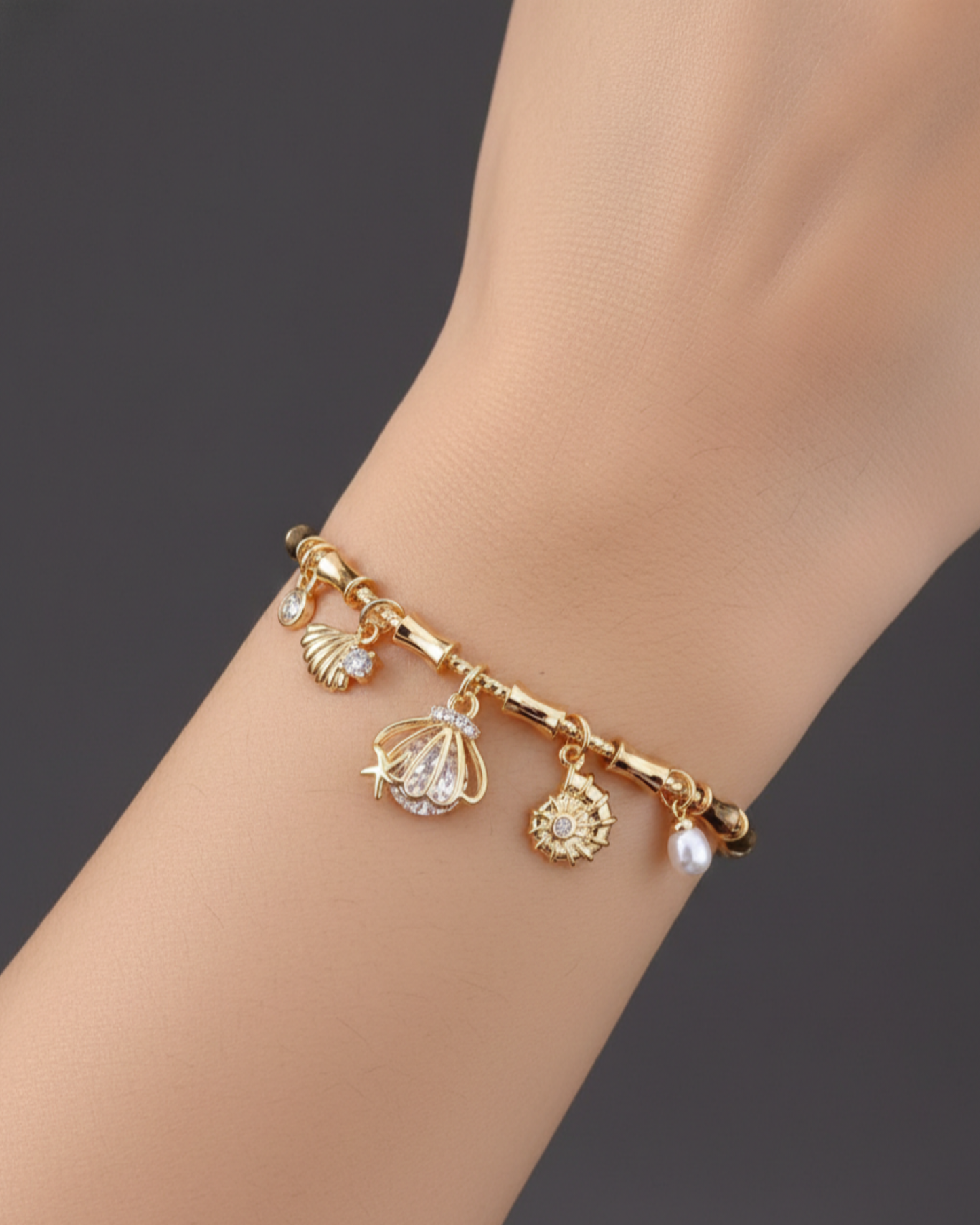 Handcrafted Artisanal Gold Charm Bracelet with Pearl & Shell Motifs